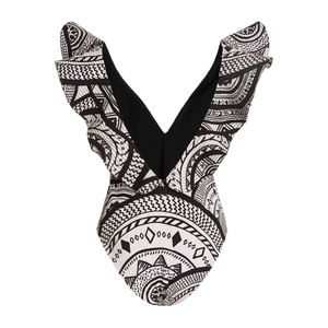Detailed view of deep V-neckline and ruffles on black and white tribal print swimsuit