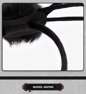 Macro detail of black plush spider headband showing hairy texture and felt construction