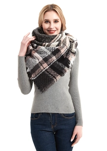 Detail of herringbone triangle shawl with soft fringe edges and a thick plaid texture