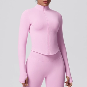 Detail view of pink yoga jacket with stand collar zipper and protective hand guard cuffs