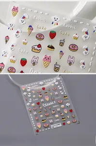 Macro detail of 3D embossed nail stickers with dessert, rabbit and donut patterns