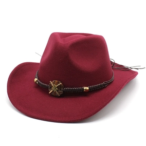 Close-up of wine red wool felt cowboy hat with woven band and floral wood bead ornament