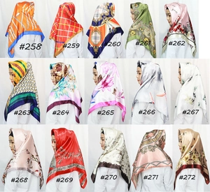 Grid display of 15 floral satin square scarves with various colorful printed patterns