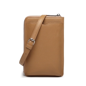 Detail view of khaki pebbled leather mini crossbody wallet bag with adjustable strap