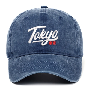 Close-up of Tokyo 3D embroidery on a navy blue washed denim baseball cap detail