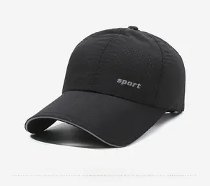 Close-up of black breathable sport cap with laser-cut holes and silver reflective brim edge