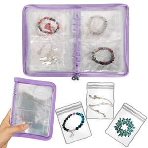 Detail of purple jewelry organizer binder with transparent PVC storage bags and zippers