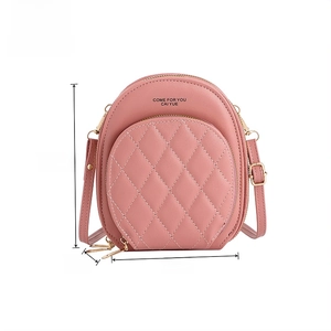 Pink quilted crossbody bag detail showing 18.5cm height and 15cm width dimensions