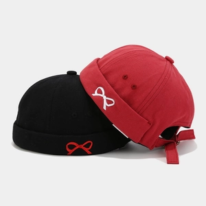 Classic black and red Miki hats with bow embroidery and adjustable strap back