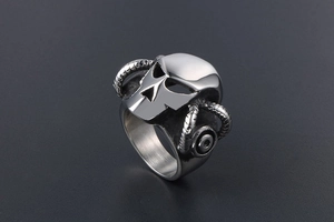 Detailed side view of punk stainless steel skull ring with ram horns and mechanical texture