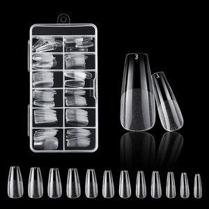 Macro view of transparent ballet shaped false nails in a storage box with size numbers