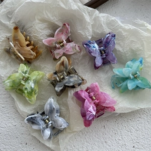Artistic oil painting style 3D butterfly hair claws in various marble and tortoiseshell patterns