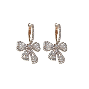 Elegant gold bow earrings with shimmering rhinestones and white pearls for women