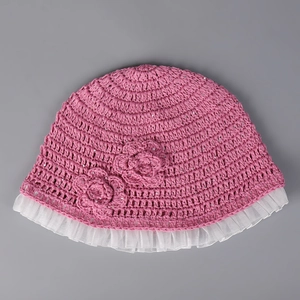 Close-up of handmade crochet bucket hat featuring sequins and floral lace details