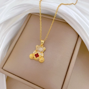 Titanium steel gold necklace with a luxury 3D crystal bear pendant and red clover