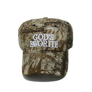 Close-up of God's Favorite white 3D embroidery on a vintage camo baseball cap