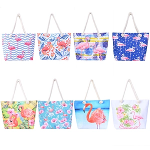 Various flamingo canvas beach bags with rope handles in eight colorful summer patterns