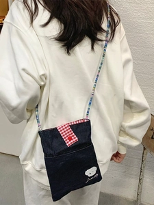 Cute denim crossbody bag with colorful beaded strap and white puppy embroidery detail