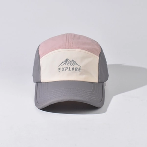 Detail of multi-color five-panel cap showing mountain embroidery and explore text