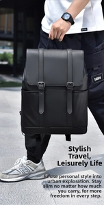 Close-up of black matte leather backpack featuring buckle straps for urban commute