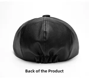 Close-up of the back of a black leather newsboy cap showing lychee texture and elastic band