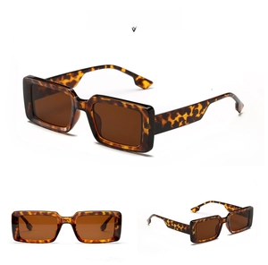 Detail view of tortoiseshell square sunglasses with brown lenses and wide temple design