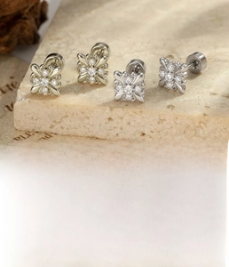 Detailed view of silver zircon flower ear studs with 0.8x6mm screw back labret design