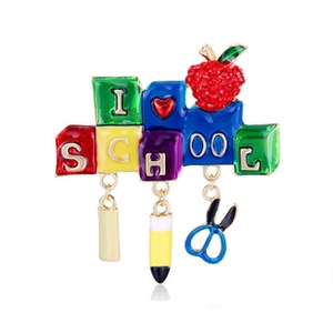 Detailed enamel school brooch with pencil, pen, and scissors pendants on white background