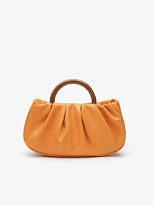 Orange pleated cloud clutch bag with a brown round resin handle and PU leather texture