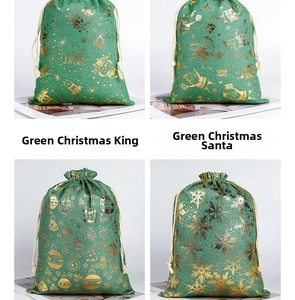 Detail of four green burlap Christmas gift bags with gold foil holiday patterns