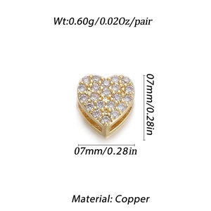 Macro shot of 18K gold plated copper heart stud earrings with shiny CZ micro inlay detail