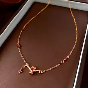 24K gold plated necklace featuring a heart ruby lamp pendant and star charms