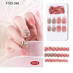 Set of 24 pieces handmade press-on nails in sheer pink with champagne diamond accents