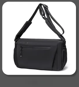 Detail of waterproof matte nylon messenger bag featuring adjustable strap and padded shoulder