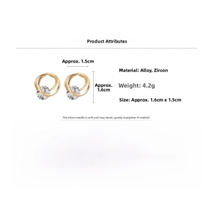 Detailed view of gold multi-ring hoop earrings with cubic zirconia and silver pin specs