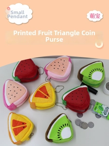 Detail of plush fruit coin purses with zipper and metal ball chain for accessories