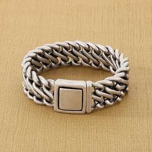 Detailed close-up of antique silver woven titanium steel chain with a square clasp buckle