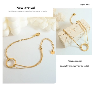 Detail of gold layered bead chain bracelet with circular link and adjustable clasp