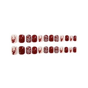 Christmas press-on nails featuring red and cream reindeer snowflake patterns set of 24
