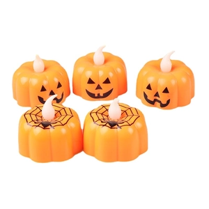 Set of 5 orange LED Halloween pumpkin lights with spooky face and spider web patterns