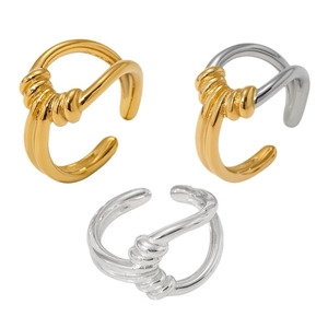 Minimalist twisted knot ear cuffs in gold and silver finish on a clean white background