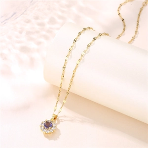 Golden titanium steel necklace featuring a purple zircon floral pendant on a beige stand