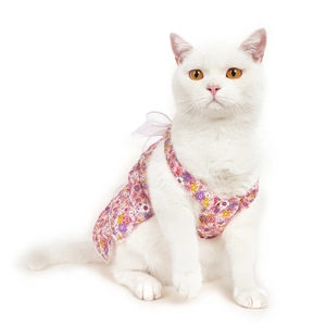 Close-up of pink floral pet dress with cotton fabric and bow tie strap details