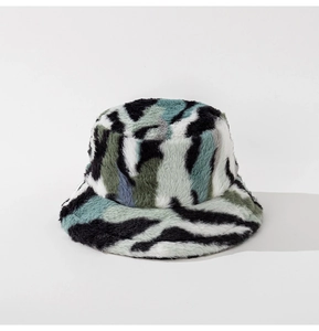 Detail of plush faux fur texture on bucket hat with gray camouflage pattern