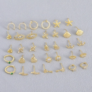 Golden stud earring set featuring heart star crown and geometric shapes with zircon