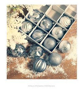 Silver 6cm Christmas ball set with assorted textures in a gift box on a winter table