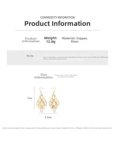 Detail view showing 7cm drop earrings made of gold-plated copper and translucent glass