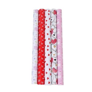 Five assorted rolls of heart and cartoon pattern gift wrapping paper for Valentines Day