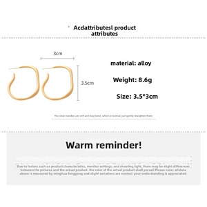 Detailed view of matte gold irregular C-shape hoop earrings with size and weight specs