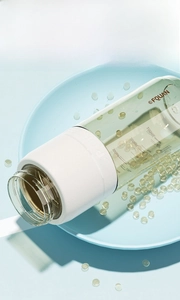 Detail view of PPSU water bottle showing white silicone sleeve and capacity scale markings